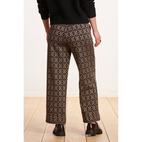 Pantalón negro con dibujo geométrico dorado - Imagen 3